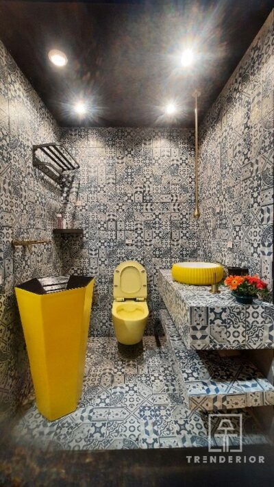 Yellow color bathroom wash basin and commode