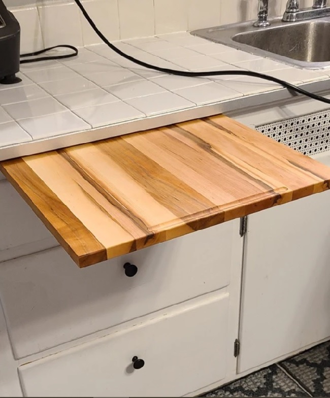 Add a pull-out cutting board